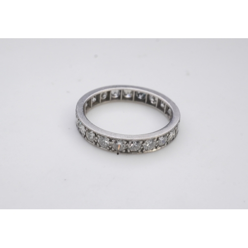 438 - A diamond eternity ring, set with a continuous line of brilliant-cut diamonds totalling approximatel... 