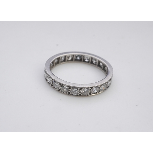 438 - A diamond eternity ring, set with a continuous line of brilliant-cut diamonds totalling approximatel... 