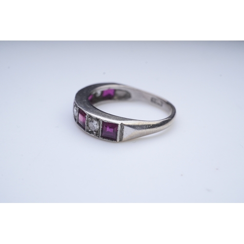 439 - A ruby and diamond half eternity ring, set to the front with a band of step-cut rubies and brilliant... 