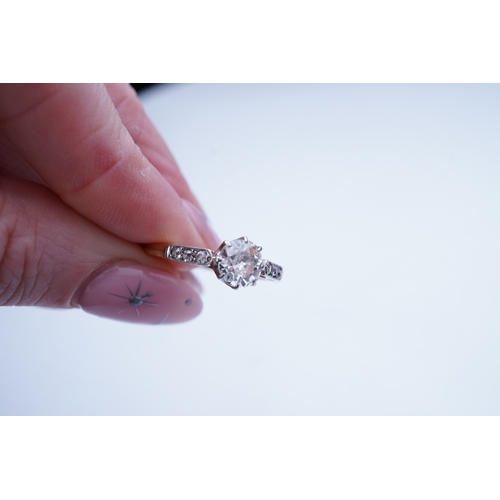 446 - A diamond ring, early 20th century, claw-set with an antique cushion-shaped diamond weighing approxi... 