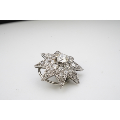 449 - A pair of Art Deco diamond ear clips, 1930s, each designed as an eight-rayed star, pavé-set with cus... 