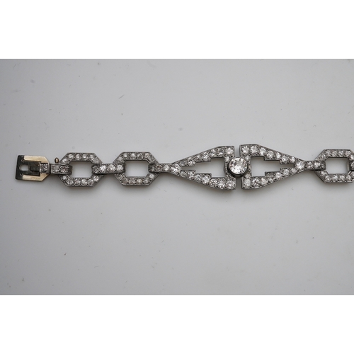 450 - An Art Deco diamond bracelet, France, circa 1930, composed of geometric linking, set with circular-c... 