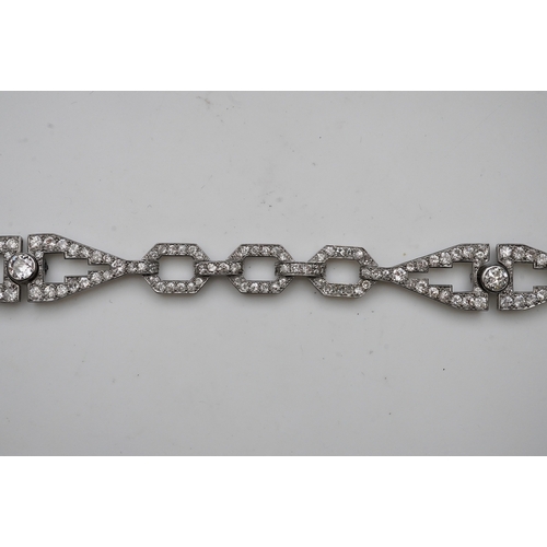 450 - An Art Deco diamond bracelet, France, circa 1930, composed of geometric linking, set with circular-c... 