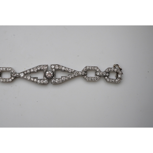 450 - An Art Deco diamond bracelet, France, circa 1930, composed of geometric linking, set with circular-c... 