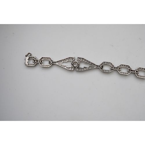 450 - An Art Deco diamond bracelet, France, circa 1930, composed of geometric linking, set with circular-c... 