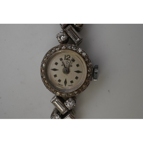 451 - Aster, a stylish lady's diamond cocktail watch, 1960s, the circular silvered dial within a bezel set... 