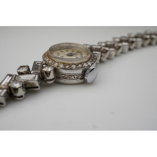 451 - Aster, a stylish lady's diamond cocktail watch, 1960s, the circular silvered dial within a bezel set... 