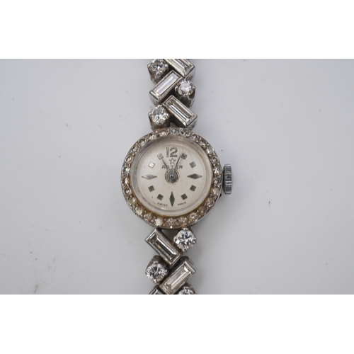 451 - Aster, a stylish lady's diamond cocktail watch, 1960s, the circular silvered dial within a bezel set... 