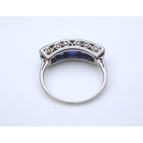 452 - An Art Deco sapphire ring, 1930s, designed as a sequence of five channel-set calibré-cut sapphires, ... 