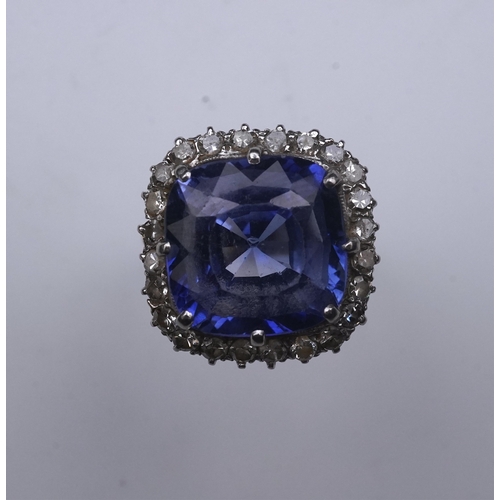 454 - A synthetic sapphire and diamond cluster ring, early 20th century, of cluster design, set with a cus... 