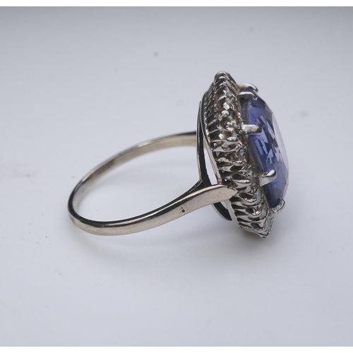 454 - A synthetic sapphire and diamond cluster ring, early 20th century, of cluster design, set with a cus... 