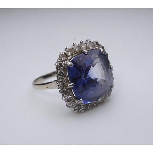 454 - A synthetic sapphire and diamond cluster ring, early 20th century, of cluster design, set with a cus... 