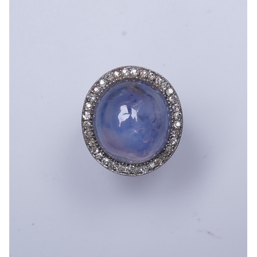 456 - A star sapphire and diamond ring, early 20th century, set with a cabochon star sapphire weighing app... 