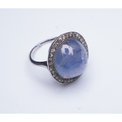 456 - A star sapphire and diamond ring, early 20th century, set with a cabochon star sapphire weighing app... 