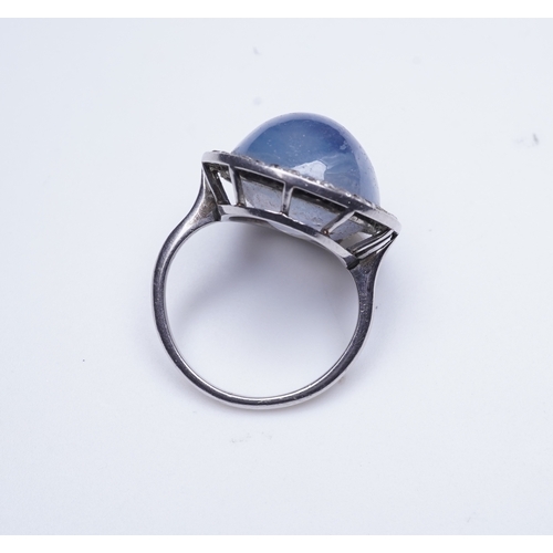 456 - A star sapphire and diamond ring, early 20th century, set with a cabochon star sapphire weighing app... 