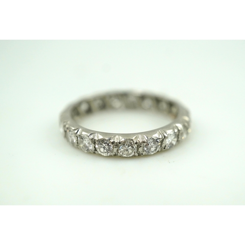 458 - A diamond eternity ring, set with a continuous band of brilliant-cut diamonds totalling approximatel... 