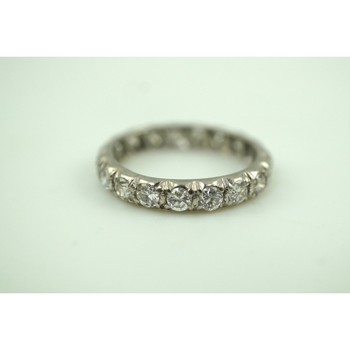 458 - A diamond eternity ring, set with a continuous band of brilliant-cut diamonds totalling approximatel... 