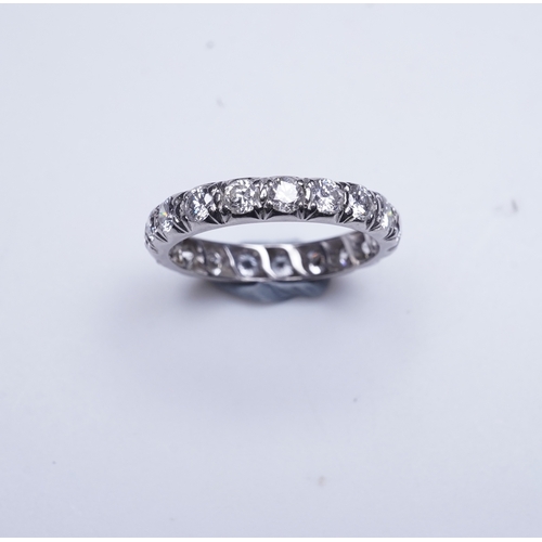 458 - A diamond eternity ring, set with a continuous band of brilliant-cut diamonds totalling approximatel... 