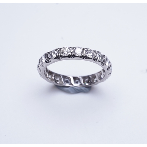 458 - A diamond eternity ring, set with a continuous band of brilliant-cut diamonds totalling approximatel... 