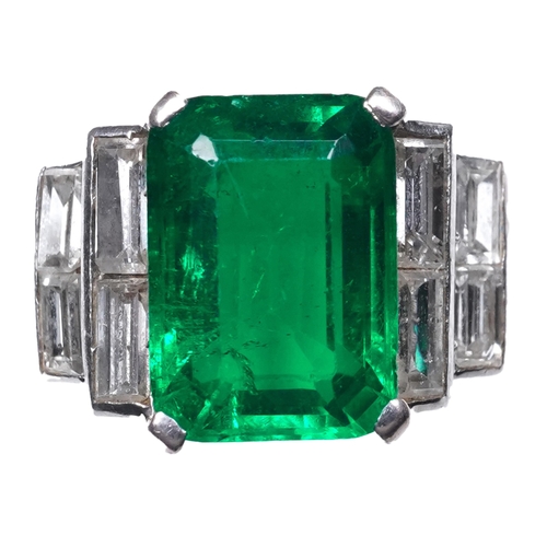 465 - A fine Art Deco emerald and diamond ring, circa 1930 claw-set with a step-cut emerald weighing appro... 