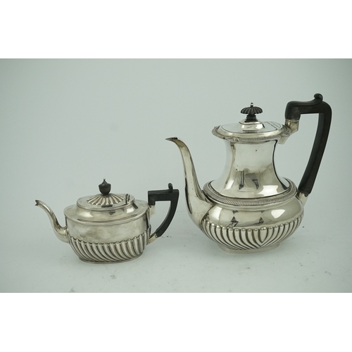 52 - An Edwardian demi-fluted silver oval coffee pot by Mappin & Webb, Sheffield, 1902 and a similar tea ... 