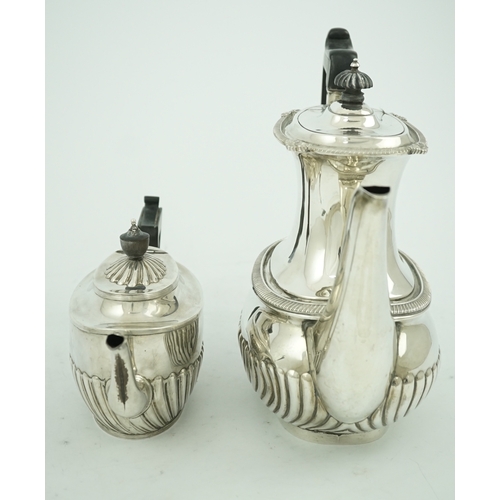 52 - An Edwardian demi-fluted silver oval coffee pot by Mappin & Webb, Sheffield, 1902 and a similar tea ... 