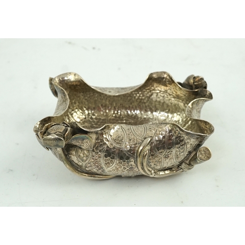 57 - An early 20th century Japanese silver lotus brush washer, of planished rounded rectangular form with... 