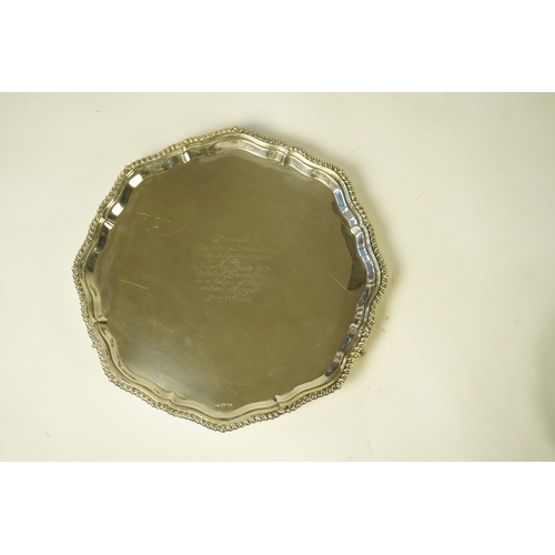 59 - An Edwardian silver salver, by Mappin & Webb, of shaped circular form, with gadrooned border and lat... 