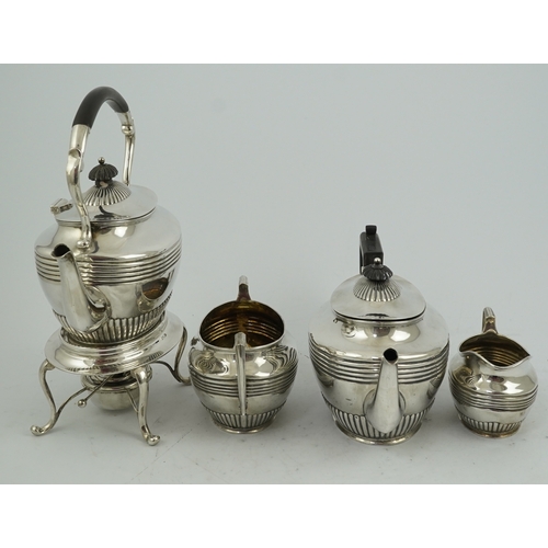 62 - A matched Edwardian Scottish four piece demi fluted oval silver tea service by Wilson & Sharp, compr... 