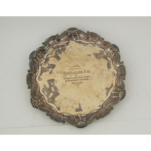 63 - An Edwardian silver salver, by Goldsmiths & Silversmiths Co Ltd, of shaped circular form, with shell... 