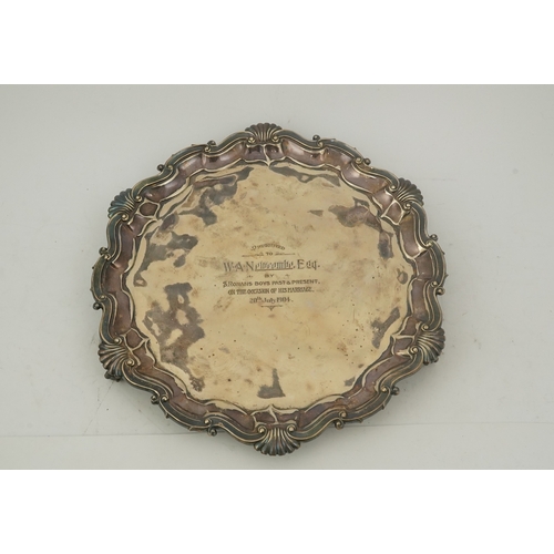 63 - An Edwardian silver salver, by Goldsmiths & Silversmiths Co Ltd, of shaped circular form, with shell... 