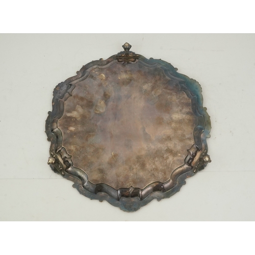 63 - An Edwardian silver salver, by Goldsmiths & Silversmiths Co Ltd, of shaped circular form, with shell... 