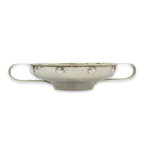 65 - A George V Arts & Crafts planished silver golf related presentation quaich. by Albert Edward Jones, ... 