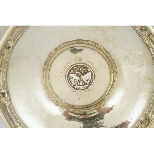 65 - A George V Arts & Crafts planished silver golf related presentation quaich. by Albert Edward Jones, ... 