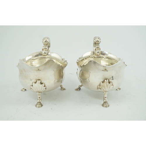 7 - A pair of late George II silver sauceboats by Robert Albin Cox, with cut borders and scroll handles,... 