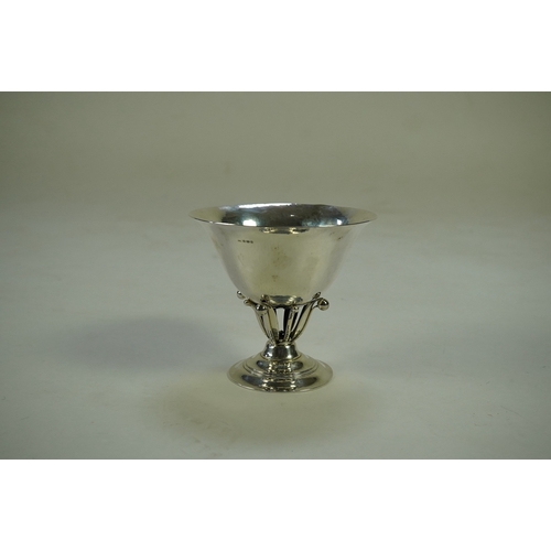 70 - A George V Johan Rohde for Georg Jensen planished silver bowl, with pierced leaf and berry stem, on ... 