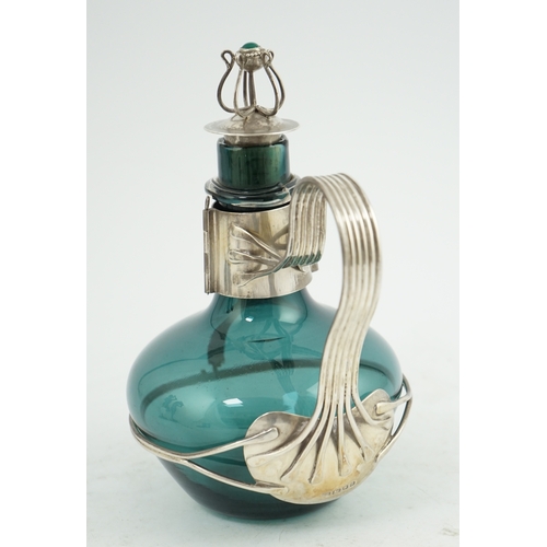 71 - A Guild of Handicraft Ltd silver mounted decanter designed by Charles Robert Ashbee, the Whitefriars... 