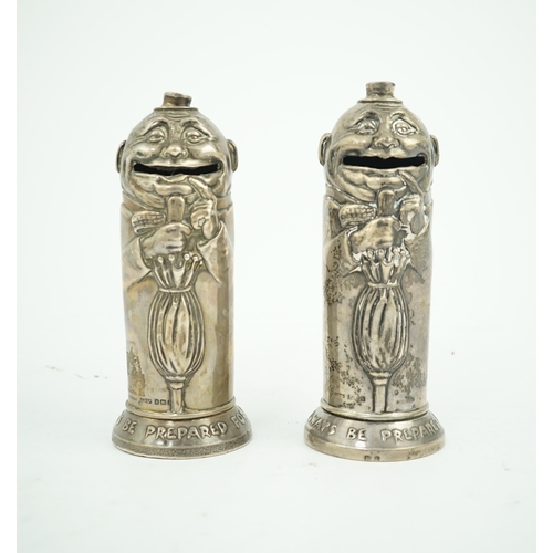 72 - A matched pair of George V novelty silver money boxes, each cylindrical box embossed as a banker wit... 