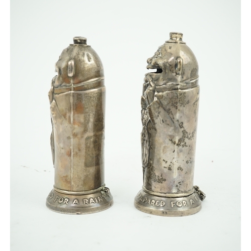 72 - A matched pair of George V novelty silver money boxes, each cylindrical box embossed as a banker wit... 