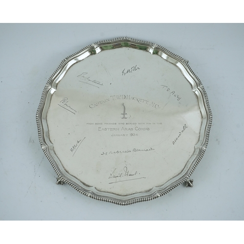 73 - A George V silver salver by Goldsmiths & Silversmiths Co Ltd, of shaped circular form, with gadroone... 