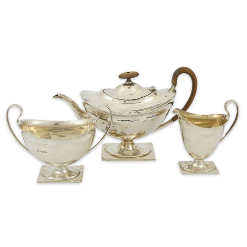 76 - A George V silver three piece tea set by Fenton Brothers Ltd, of oval pedestal form, Sheffield, 1916... 