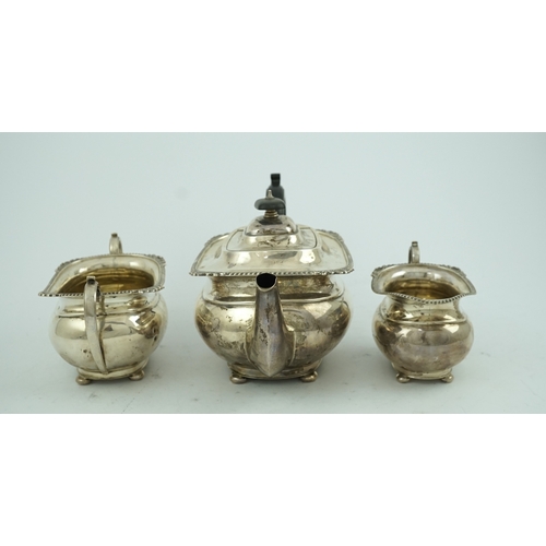 78 - A George VI  silver three piece tea set, by George Howson, of oval form, with gadrooned and shell bo... 