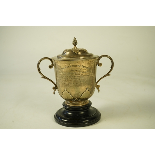 79 - A George V silver two handled presentation cup and cover by Johnson, Walker & Tolhurst, with later e... 