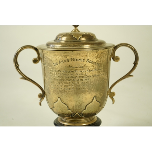 79 - A George V silver two handled presentation cup and cover by Johnson, Walker & Tolhurst, with later e... 