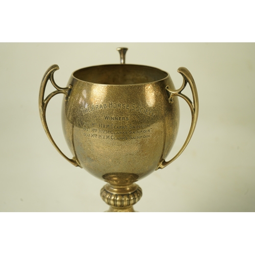 80 - A George V silver tri-handled presentation pedestal trophy cup, with engraved horse racing inscripti... 