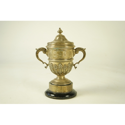 81 - A George V silver two handled presentation cup and cover, by Charles & Richard Comyns, with engraved... 