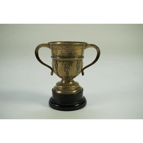 82 - A George V silver two handled presentation trophy cup by The Goldsmiths & Silversmiths Co Ltd, with ... 