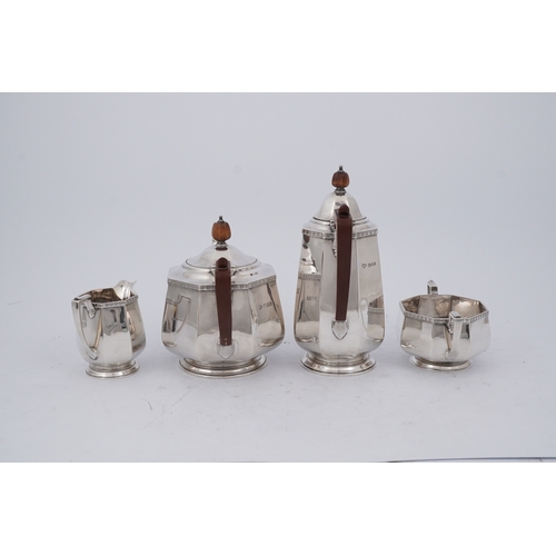 87 - A George V silver four piece octagonal tea set by Goldsmiths & Silversmiths Co Ltd, comprising a tea... 