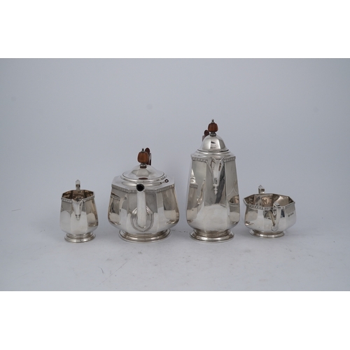 87 - A George V silver four piece octagonal tea set by Goldsmiths & Silversmiths Co Ltd, comprising a tea... 