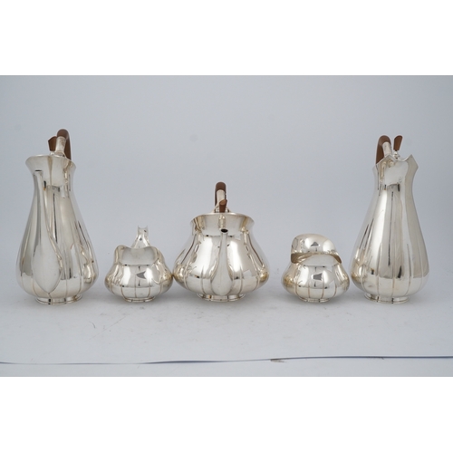 89 - A stylish 1960's Asprey & Co silver five piece tea and coffee service, of pyrifom, comprising a coff... 